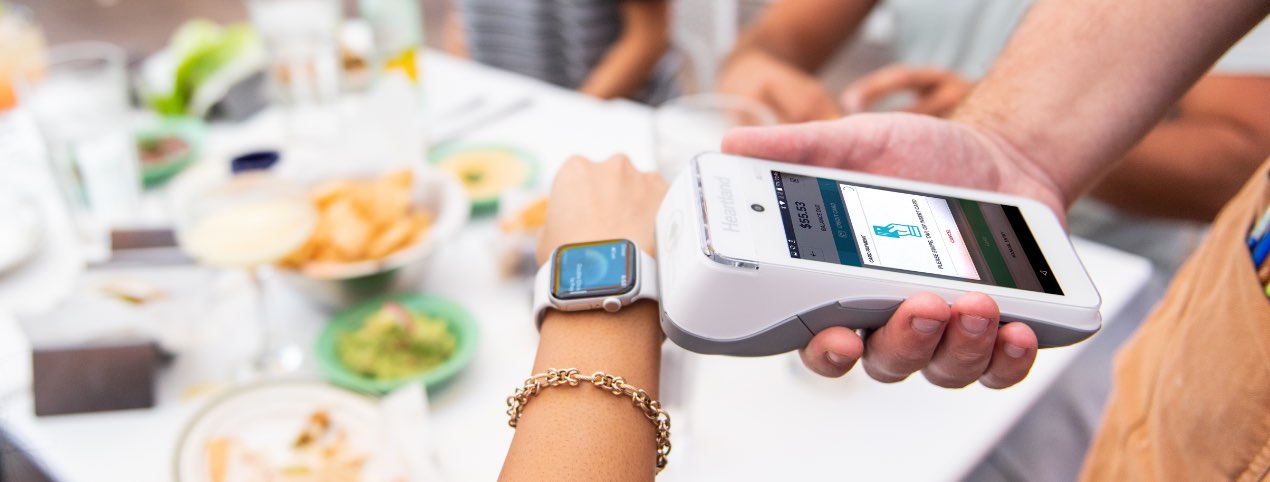 A customer making a payment via a mobile watch