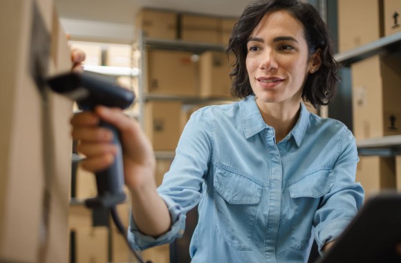 A worker scanning products