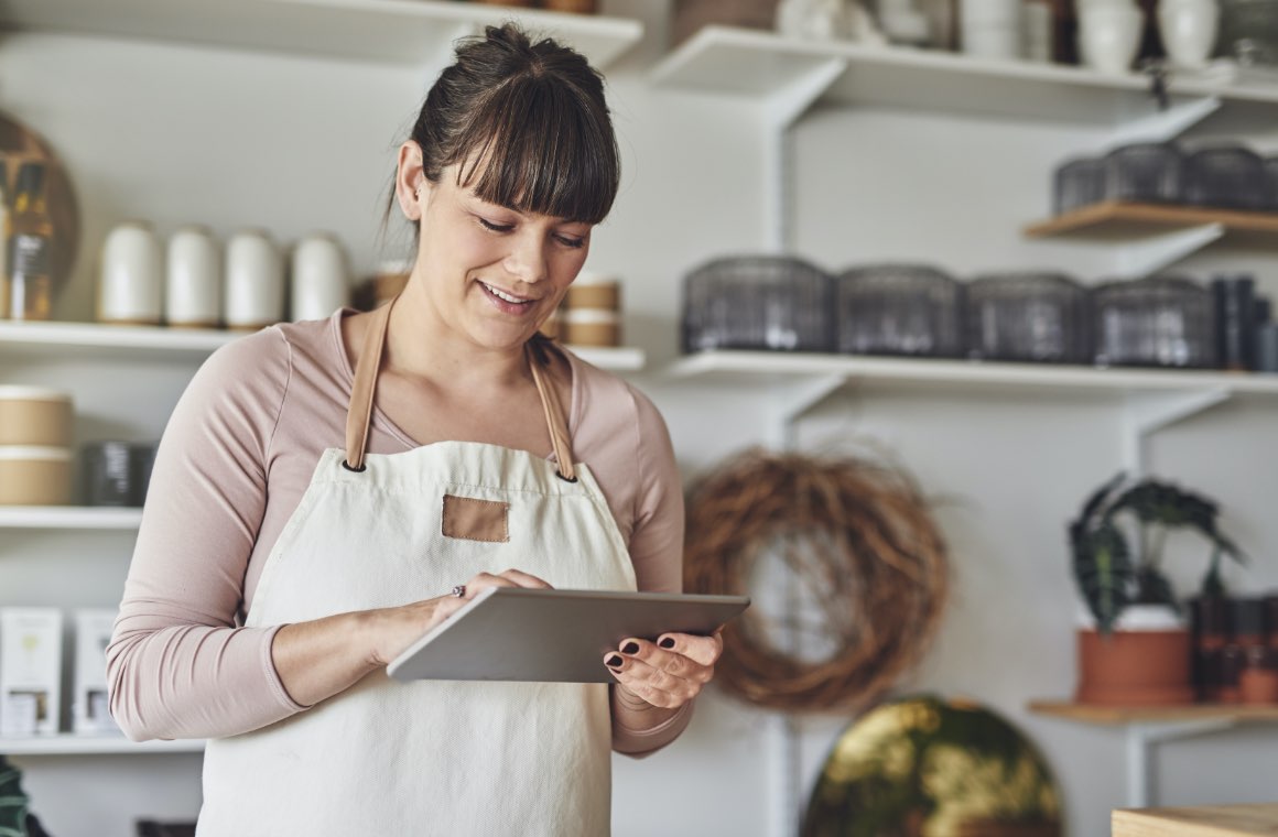A store worker looking at a tablet