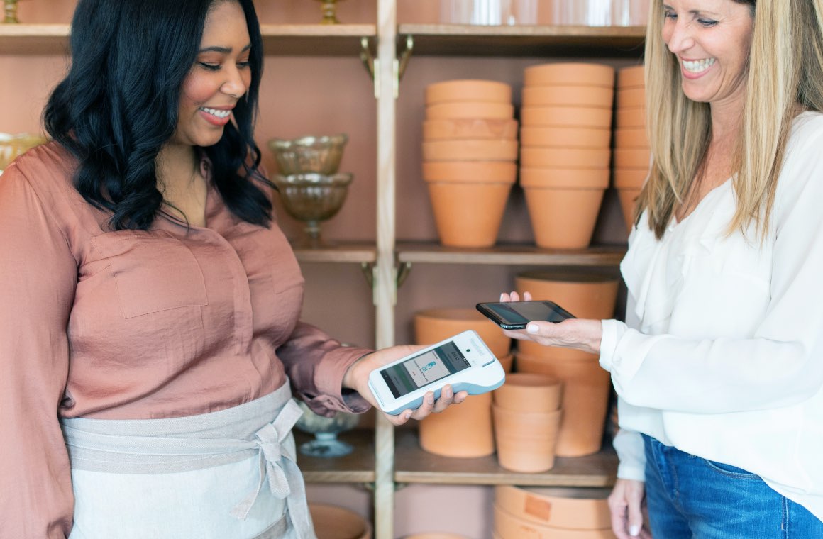A customer making a payment via mobile wallet