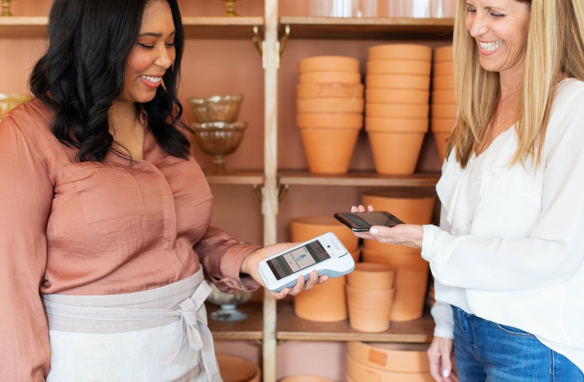 A customer making a payment via mobile wallet
