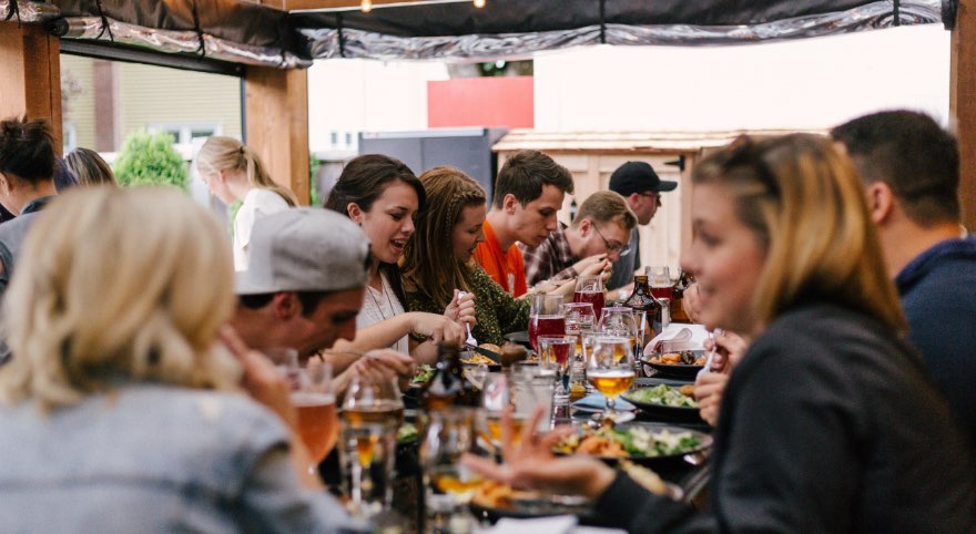 People eating at an outdoor table
