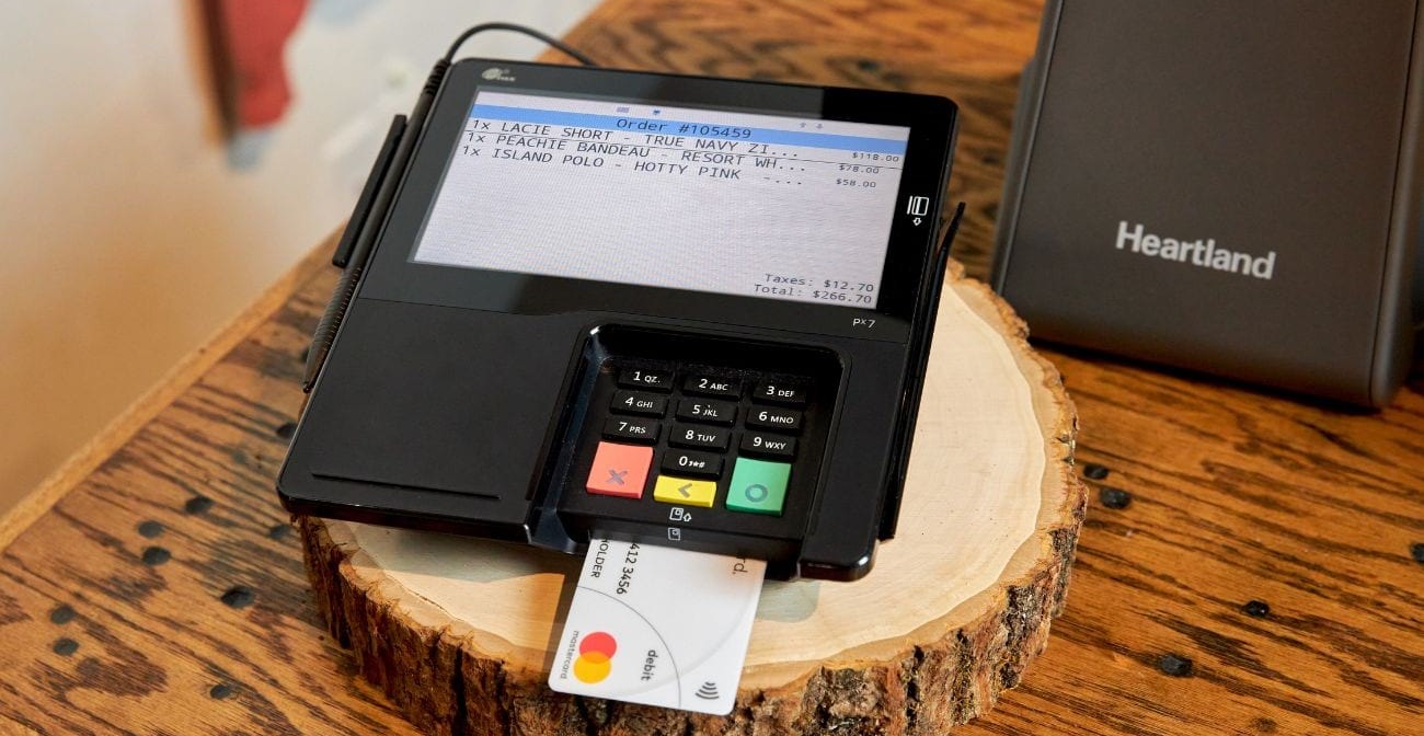 5 payment fraud statistics you need to know in 2022 - credit card inserted into terminal