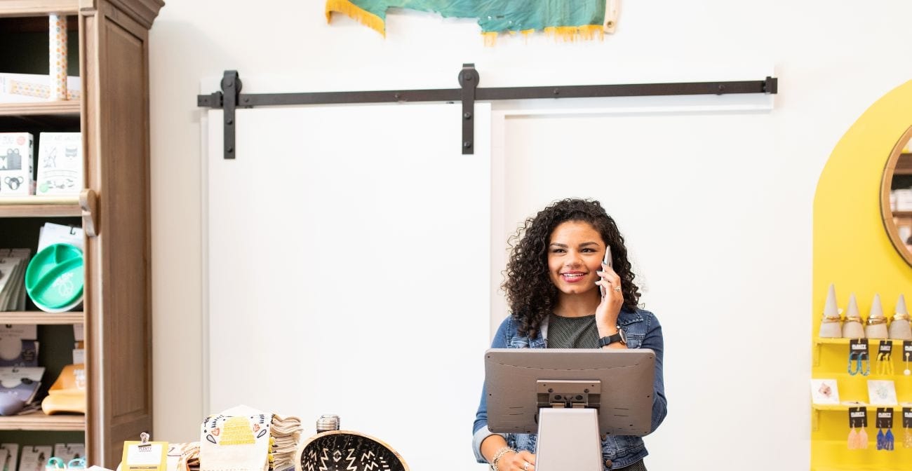 best practices for card not present chargebacks - woman taking credit card payment over the phone