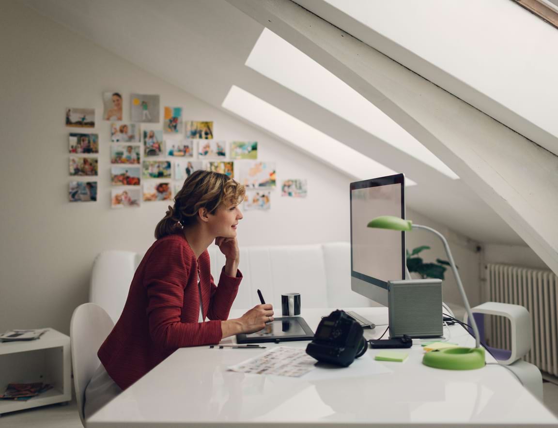 woman in an office looking at computer monitor
