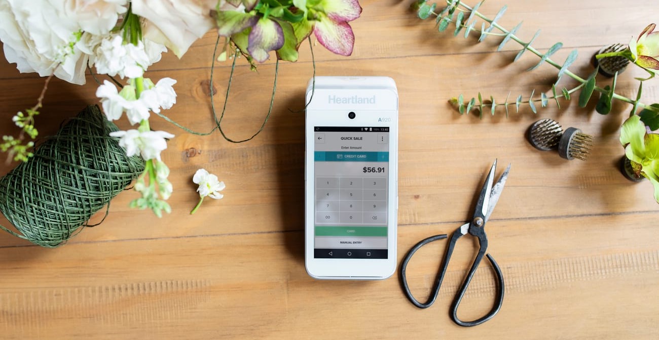 How to Pick the Right POS System for Your Church - mobile terminal on a table