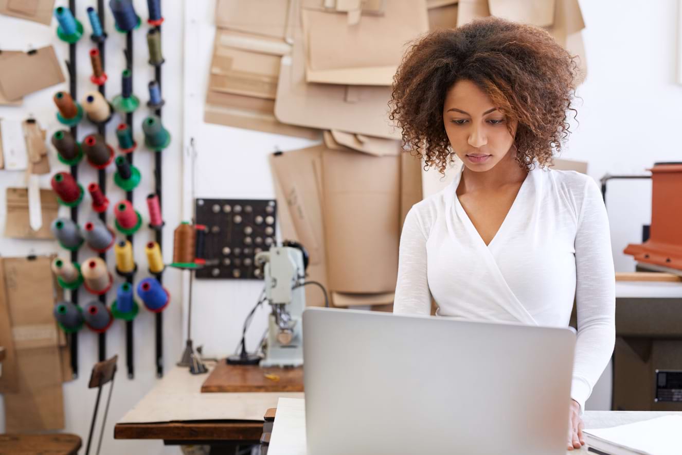 woman typing on laptop computer