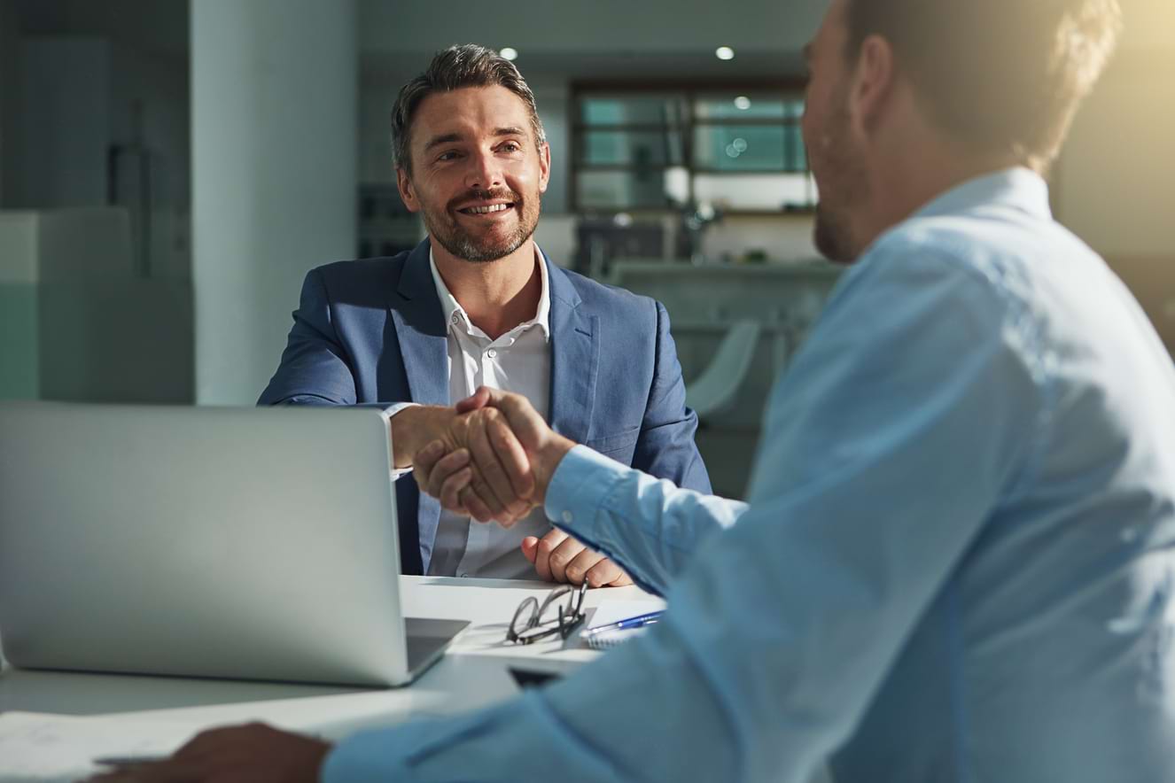 two men shaking hands 