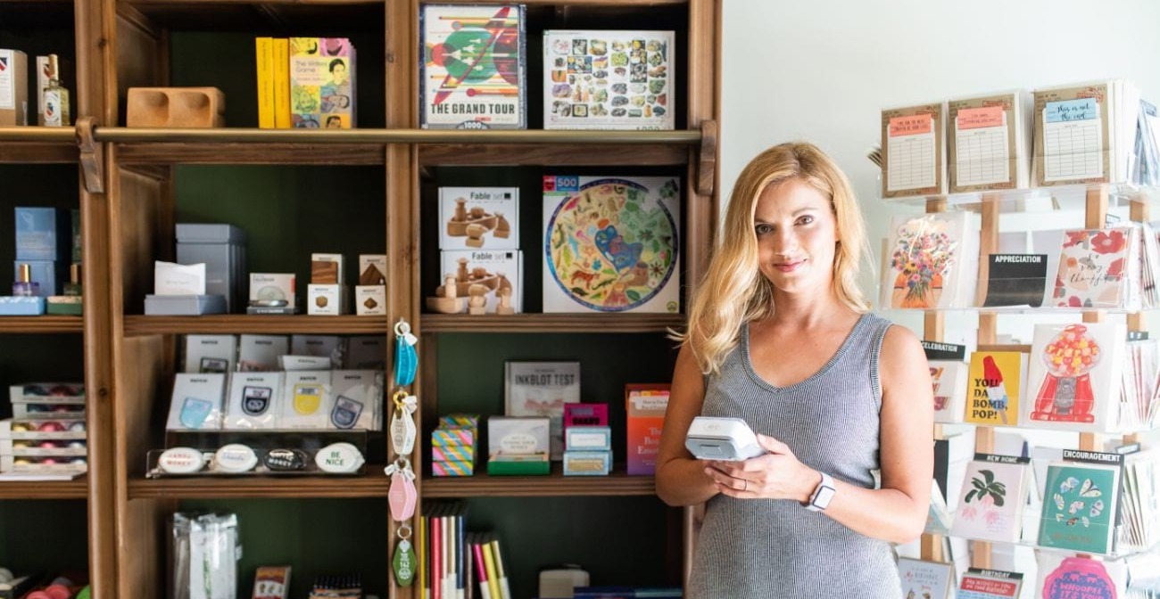 what is friendly fraud - woman by a shelf