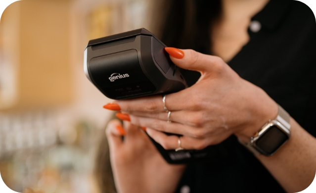 Restaurant server holding our Mobile payment device