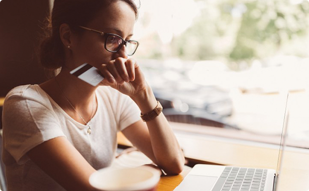 A customer making a credit card payment via online payments