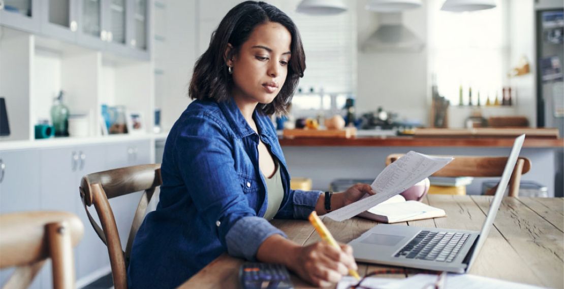 An image of a woman taking notes