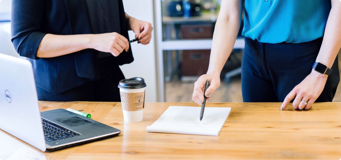 Small business owner points to details of written crisis management plan
