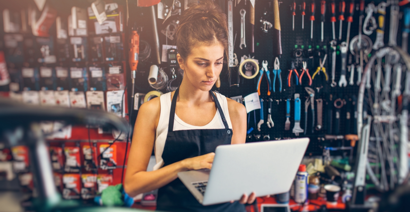 Small business owner using laptop to manage their online reviews