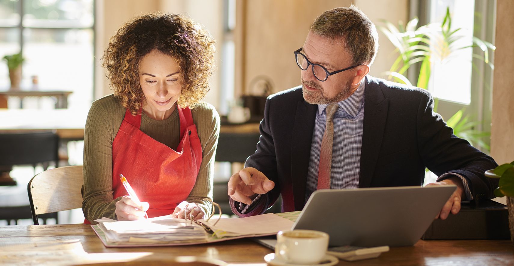 Two people discuss merchant services providers.