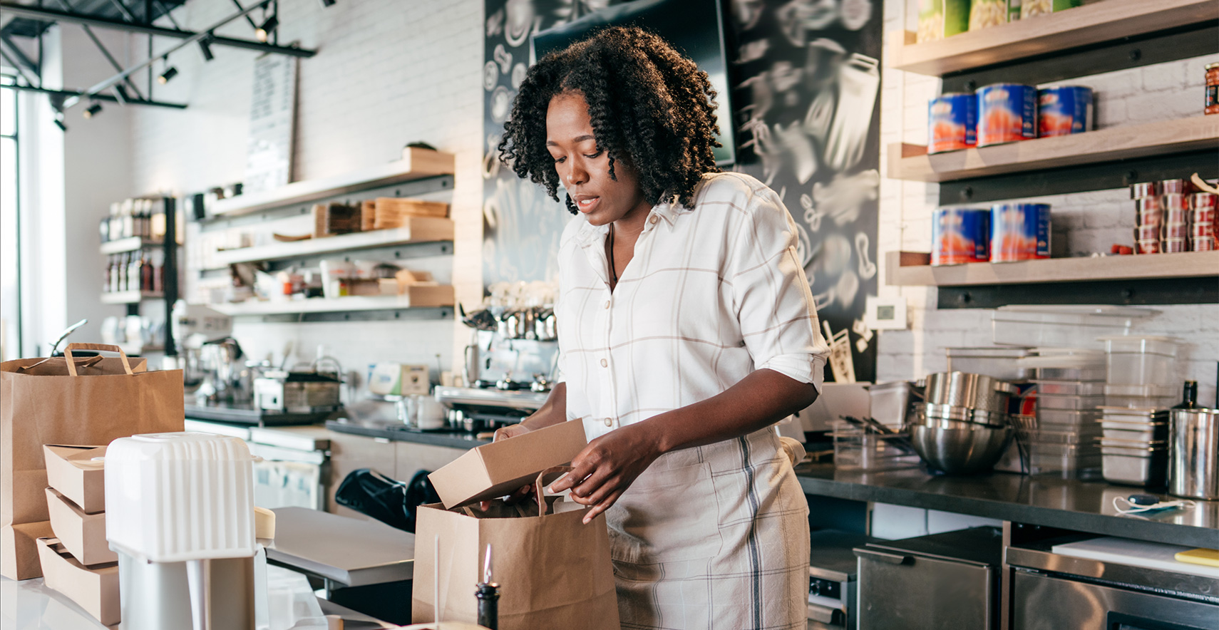 Small business owner packing items for curbside pickup